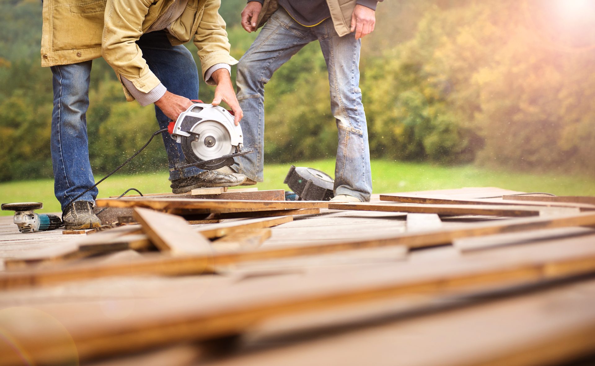 Ultimate Guide to Choosing the Best Sioux Falls Flooring for Your Home Graphicstock Detail Of Carpenters Hand Grinding Wooden Planks RCb3ATn3 Scaled